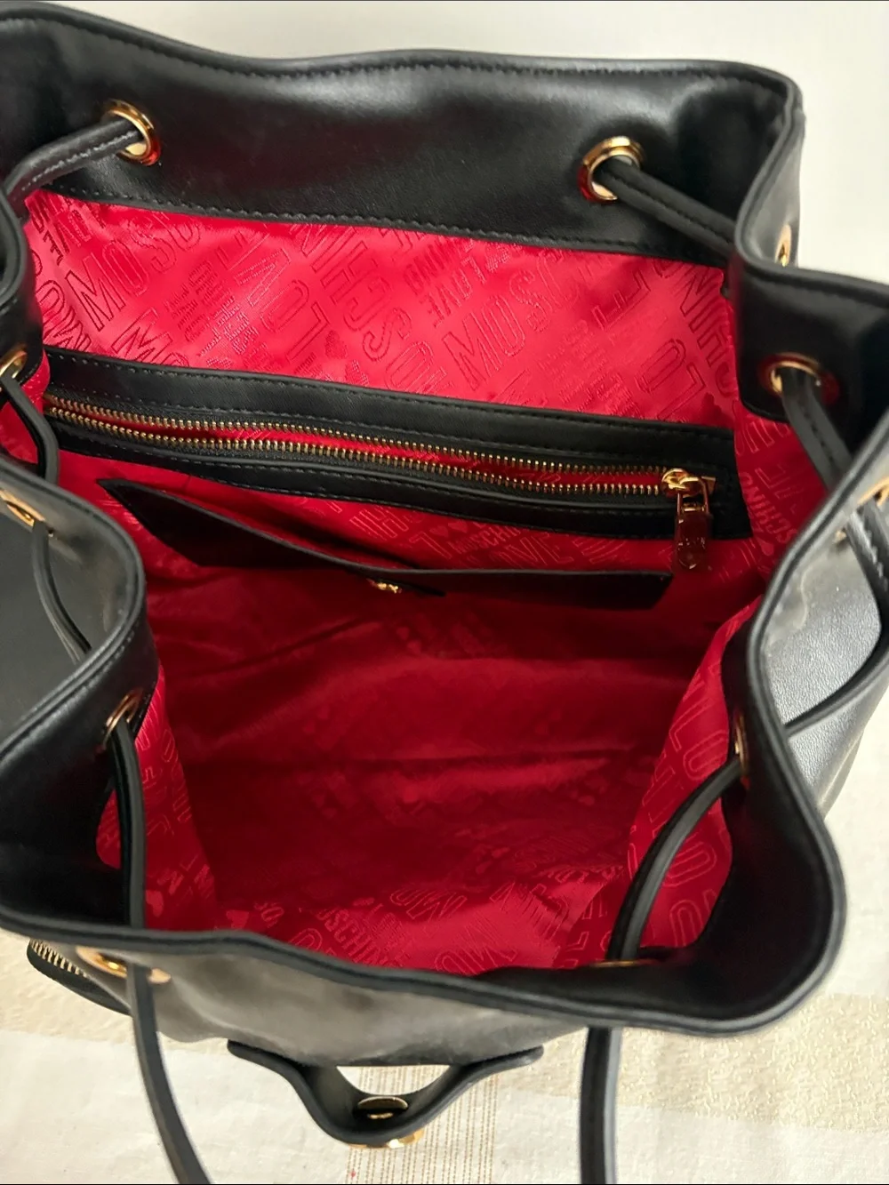 BNWOT Designer LOVE MOSCHINO Backpack, Faux Leather, with gold metal design.
